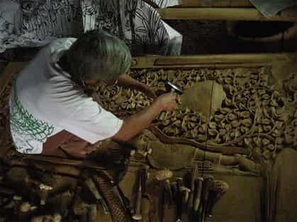 A traditioanl Thai woodcarver at work in Bann Tawai, Chiang Mai