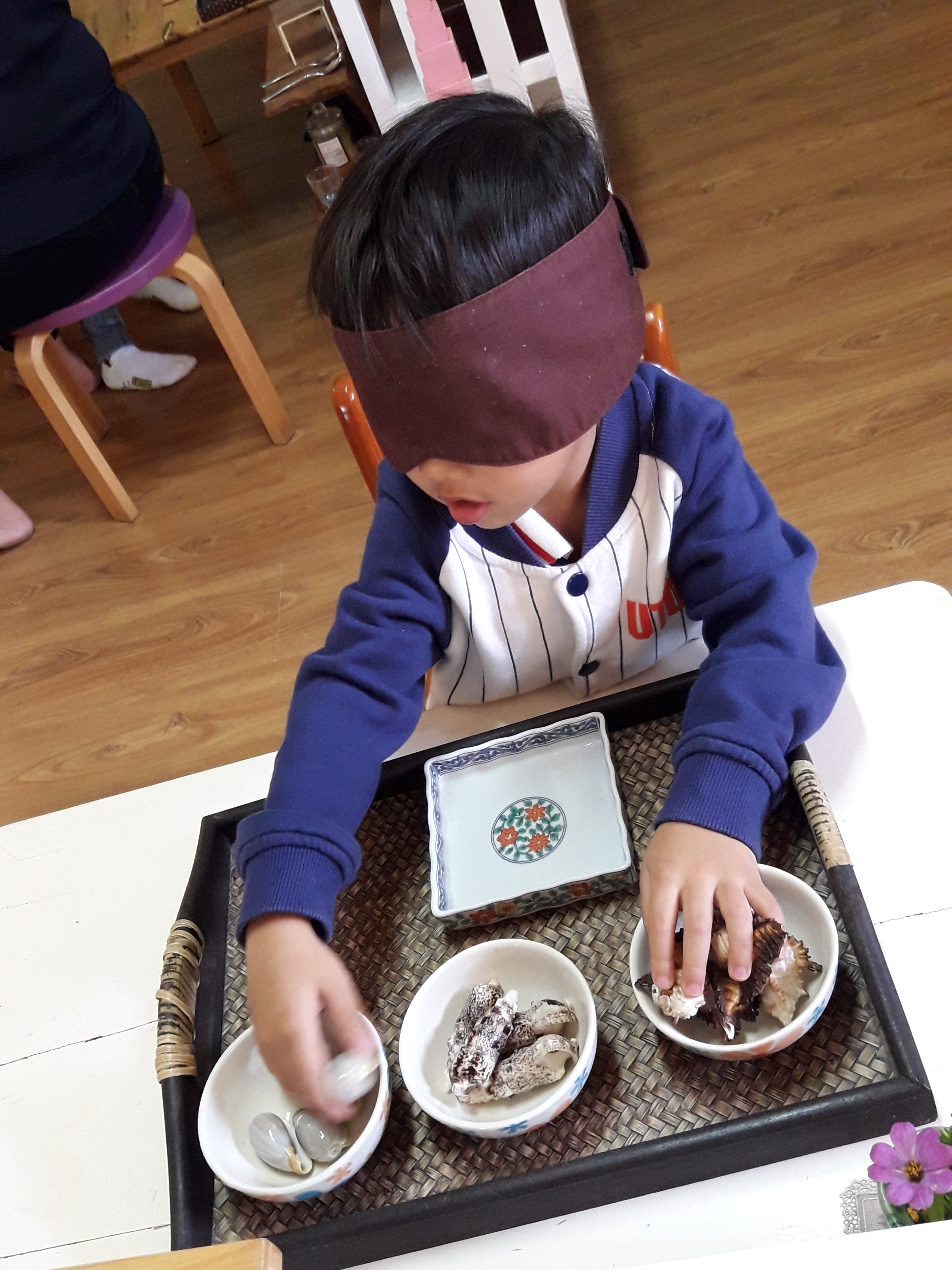 A student learning about senses at Chiang Mai Montessori School